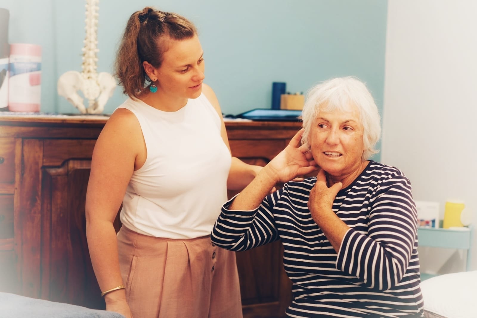 Physiotherapist Cat Meunier with a patient experiencing neck pain